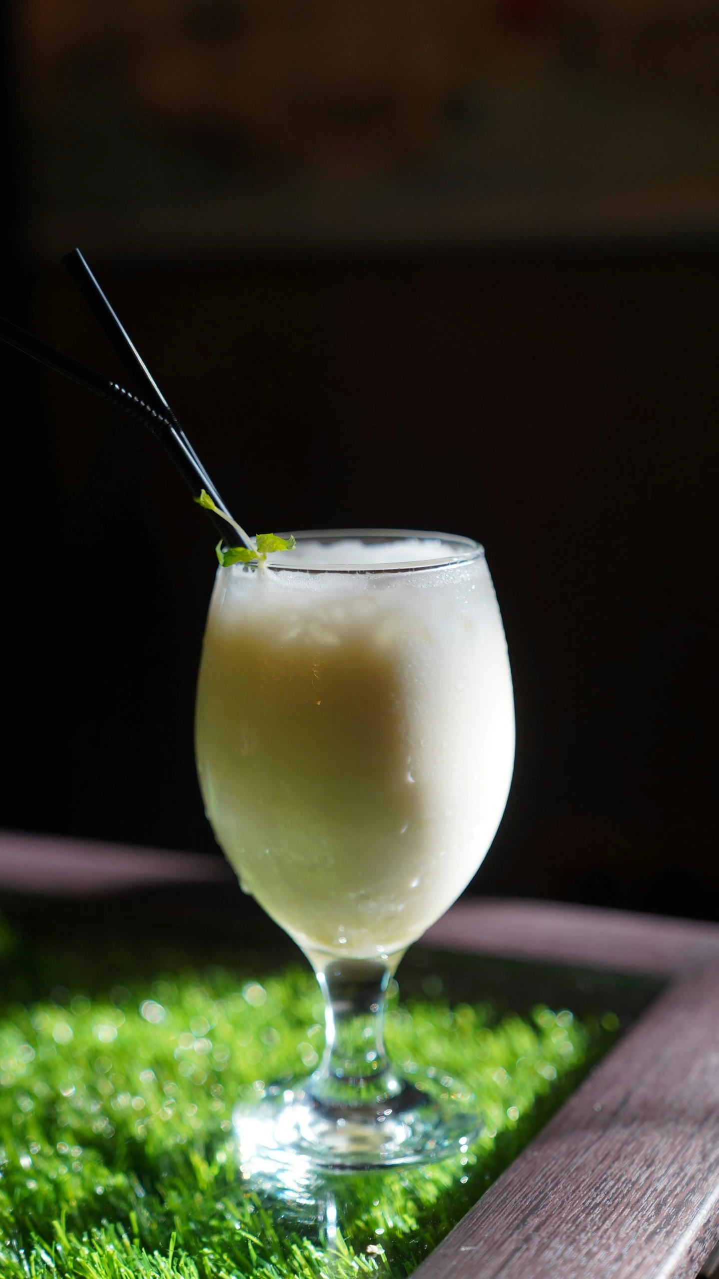 an image of a drink in the grass