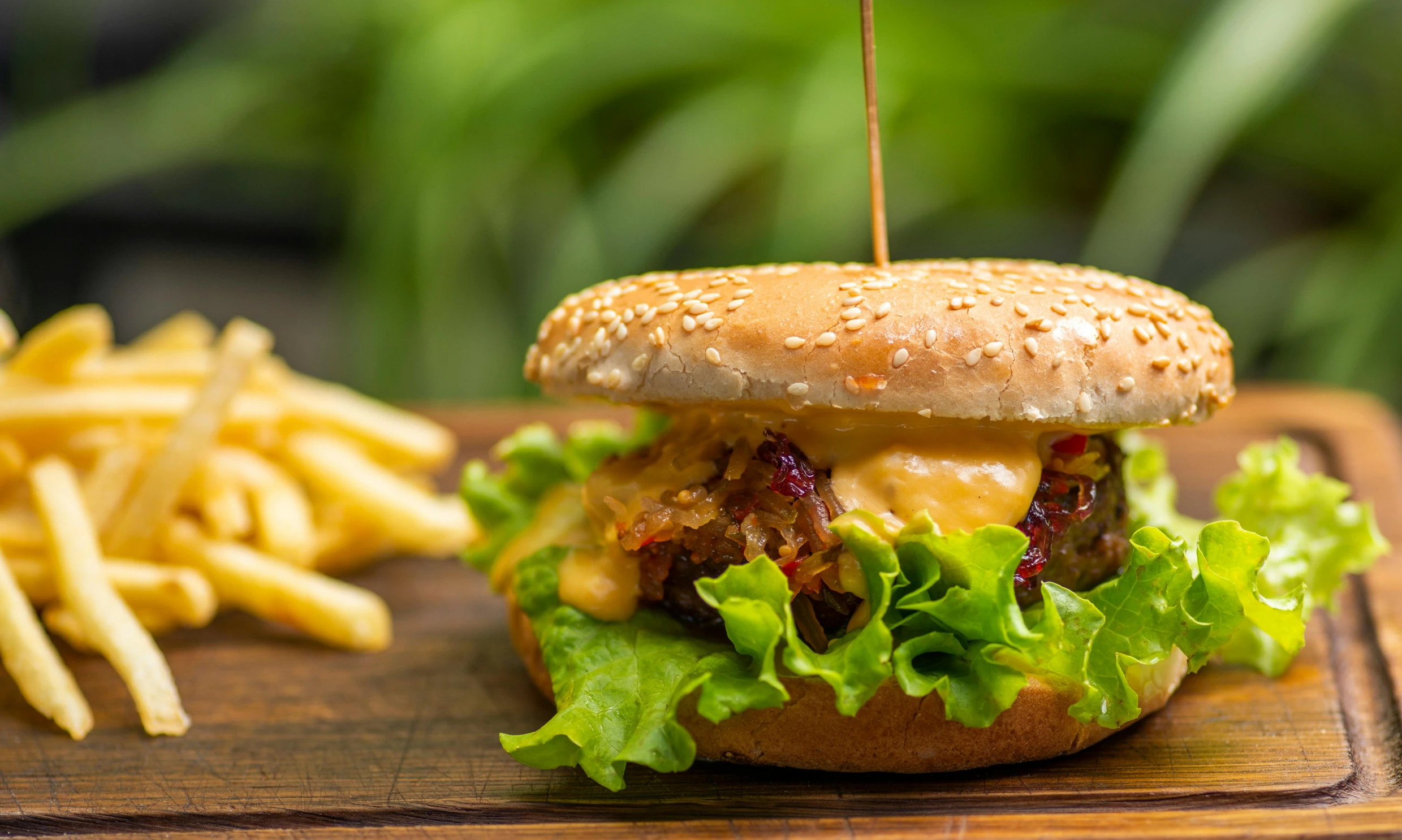 a close up of a hamburger and french fries