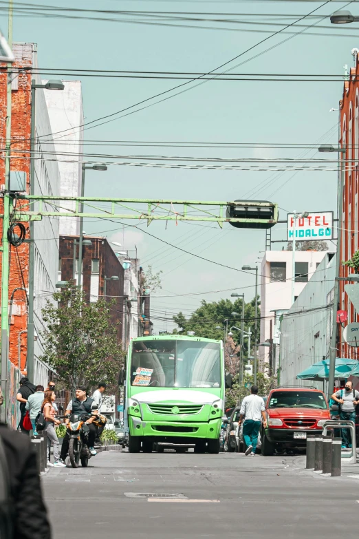 people are riding bikes down the street with an electric truck
