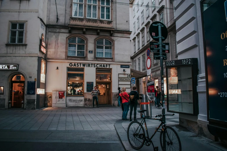 pedestrians walking through an intersection of a city