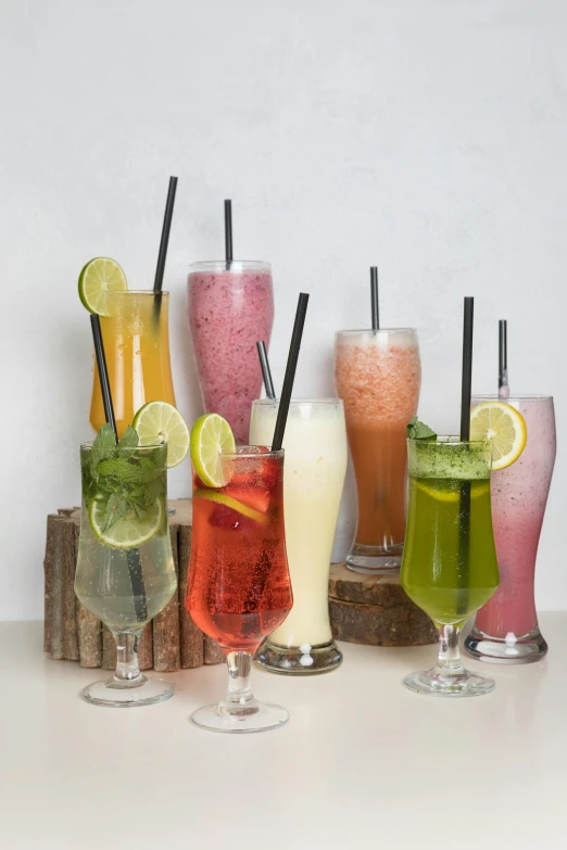 five different kinds of drinks on a wooden stand