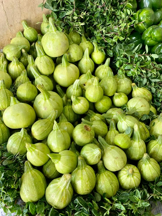 green apples and vegetables laying out on display