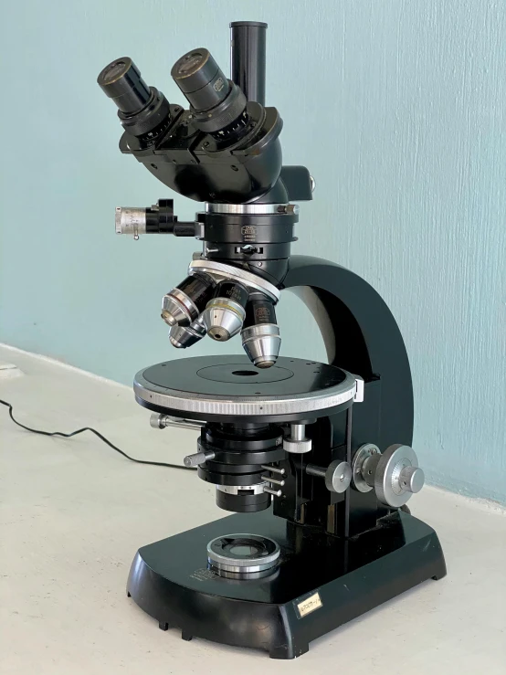 a microscope on a stand on a countertop