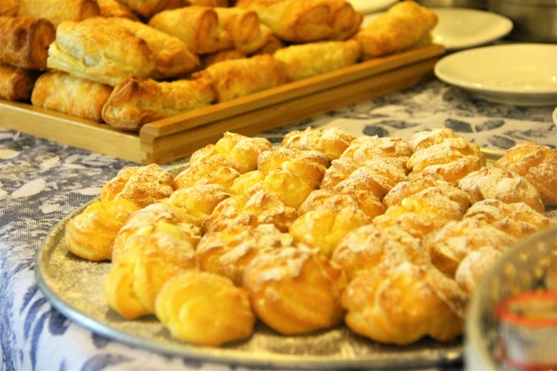 baked goods sitting on a buffet table at a restaurant