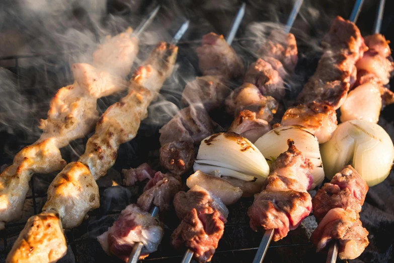 an image of many skewers on a grill