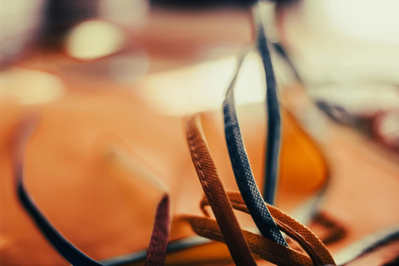 two brown glasses sitting on a table next to each other