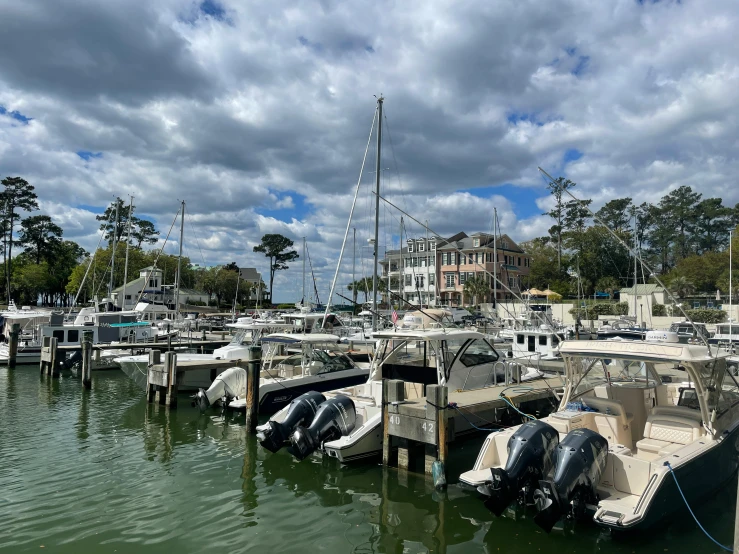 a group of boats parked in a harbor next to each other