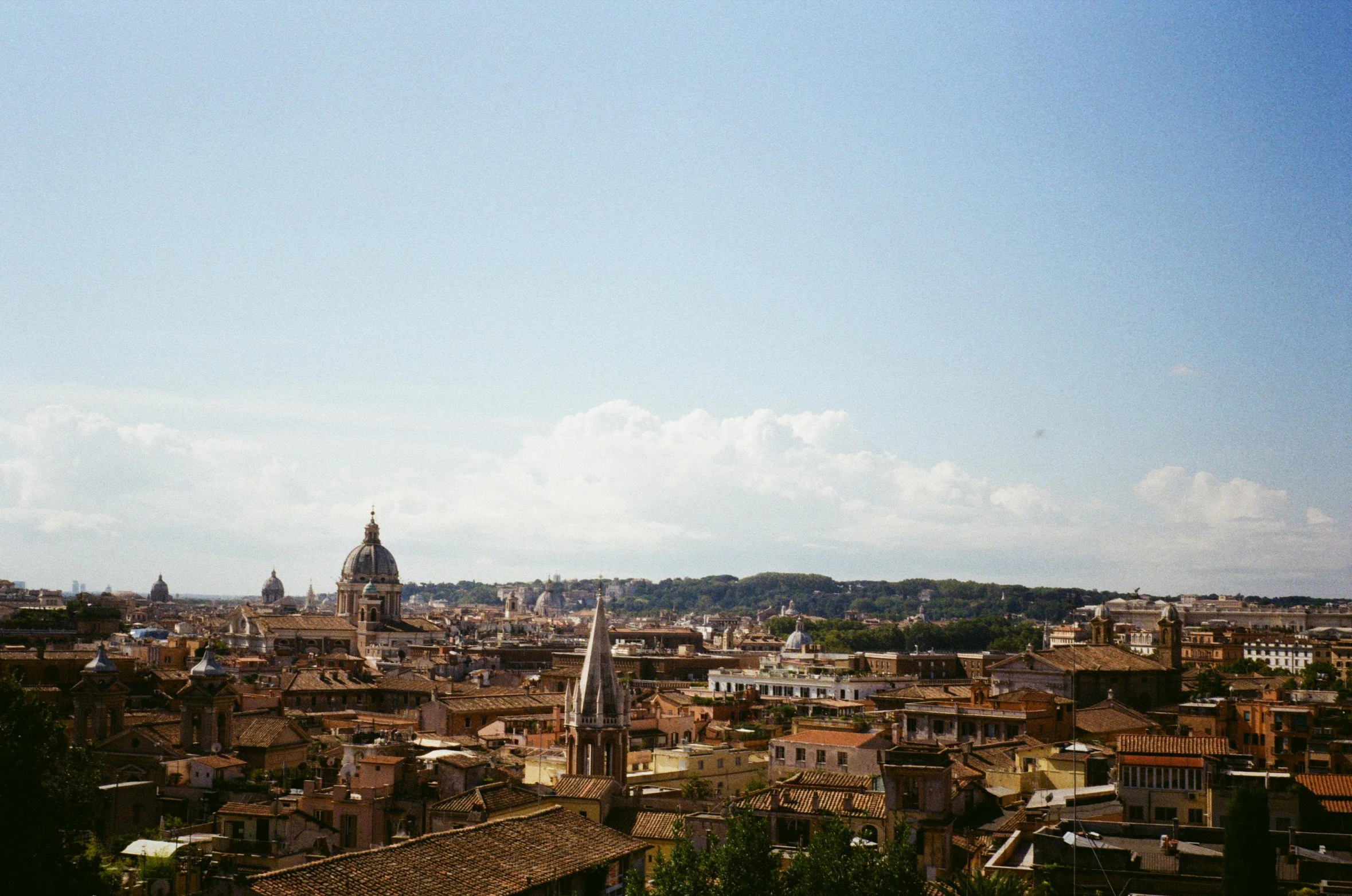 a large building stands in the middle of a city