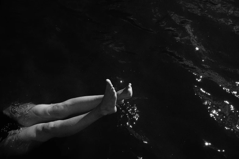 someone holds their hands in front of the night sky