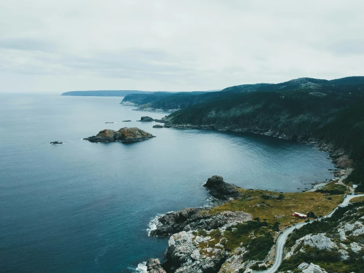 a scenic image of the water and coastline near mountains