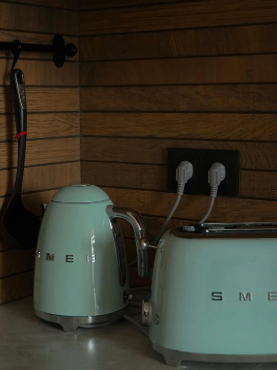 two toasters are sitting on top of the counter