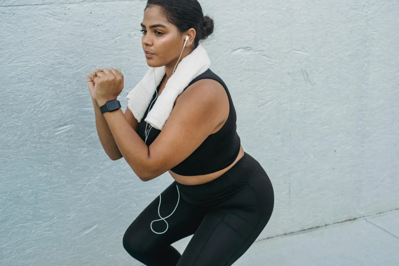 woman with her arm crossed in a cross - legged pose