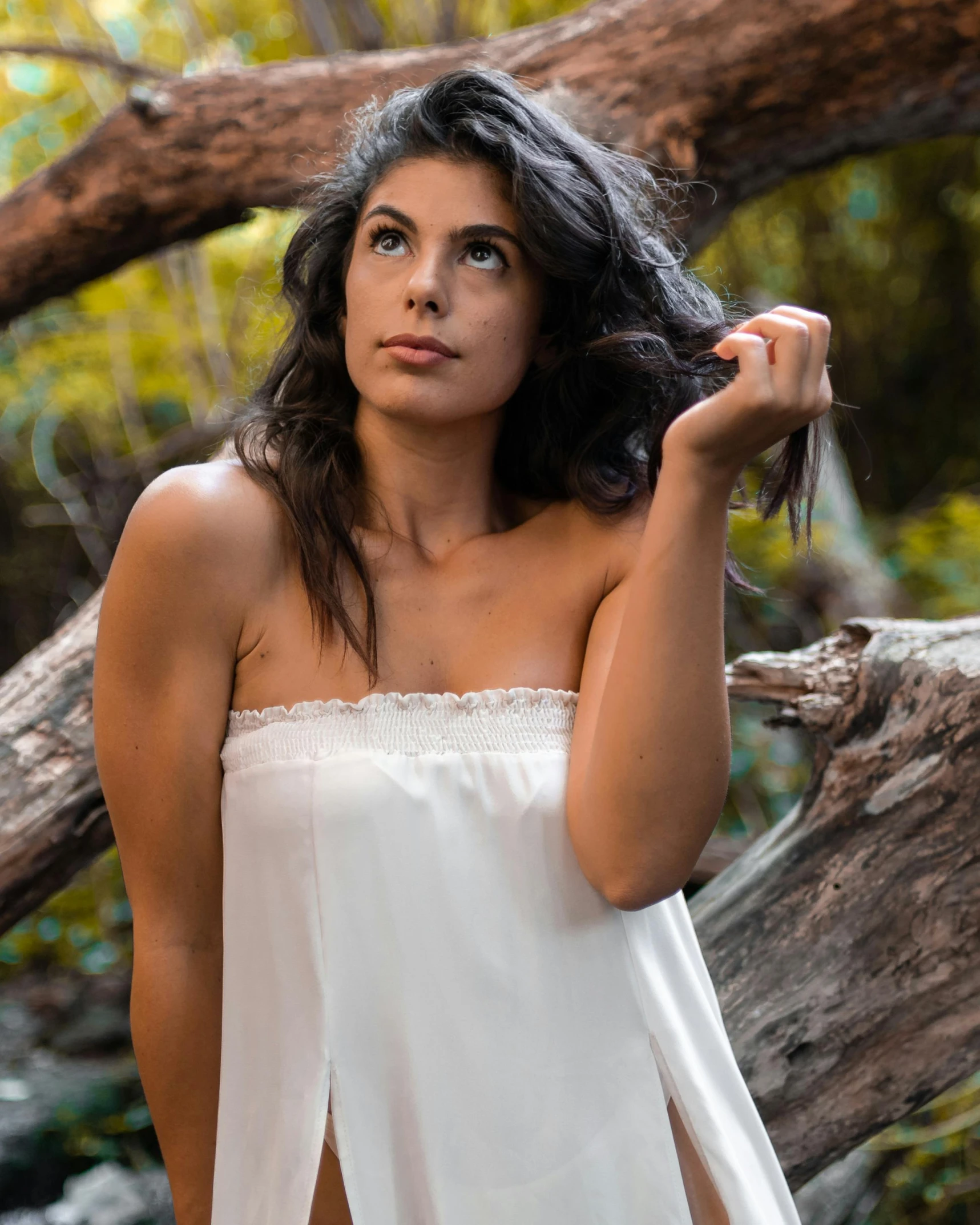 a beautiful young woman wearing a white dress