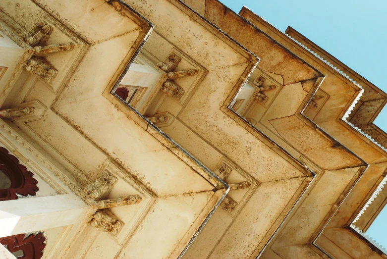 multiple large building structures stacked up against a blue sky