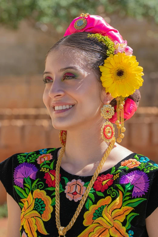 an indian woman in traditional clothing smiles