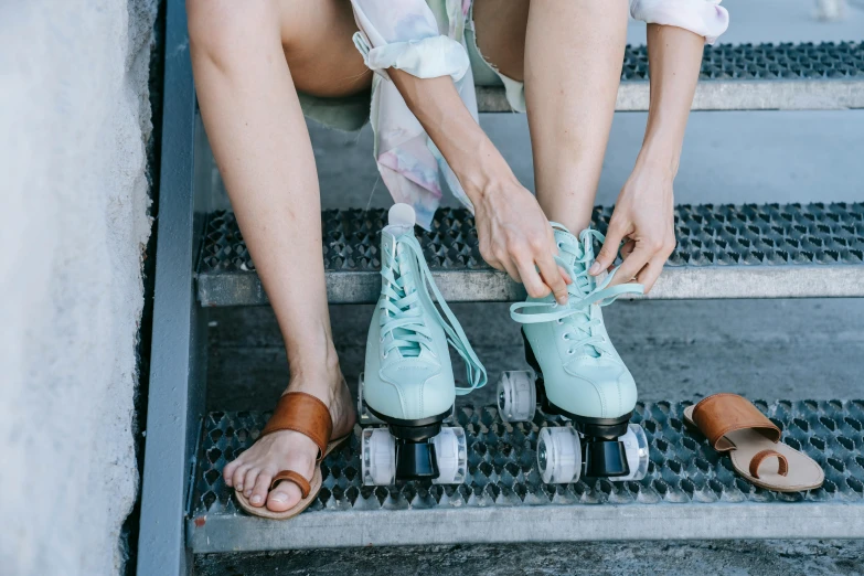 a person tying shoes on the steps at the stairs