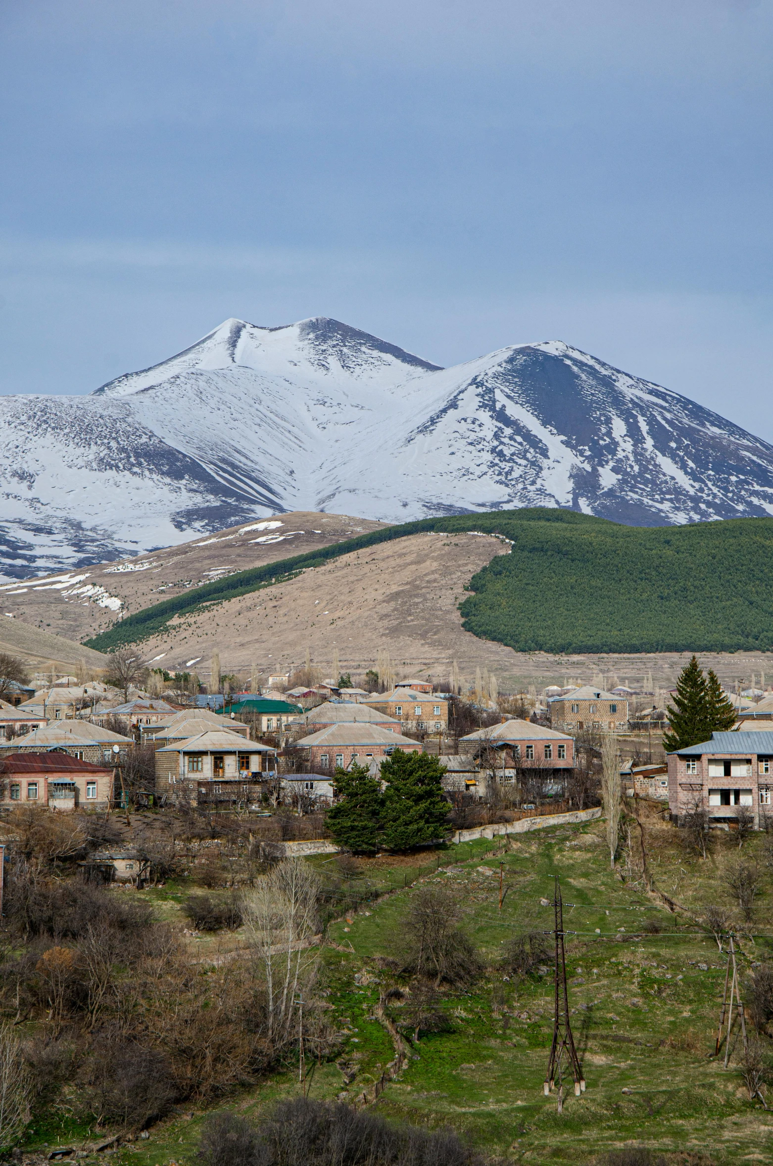 snowy mountain peaks in the distance and the city