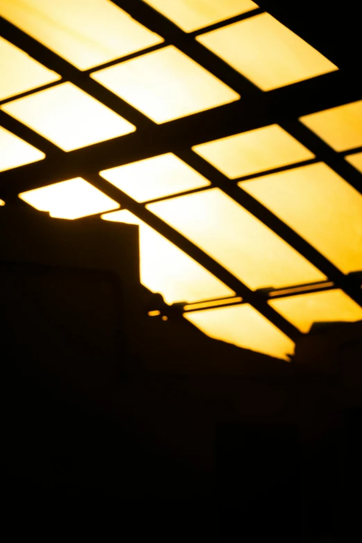 a view inside the sky through a building that appears to be closed down