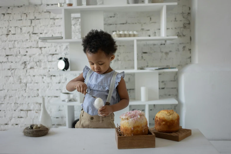 a  using a pastry maker in her home kitchen