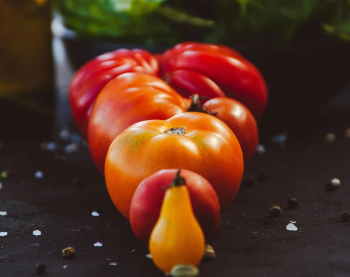 several fruits and vegetables are laying on the table