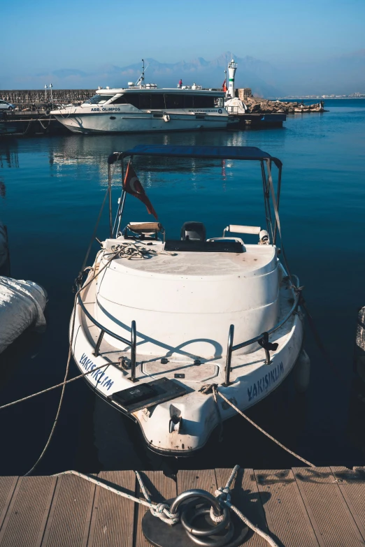 there are boats docked in the harbor with other boats