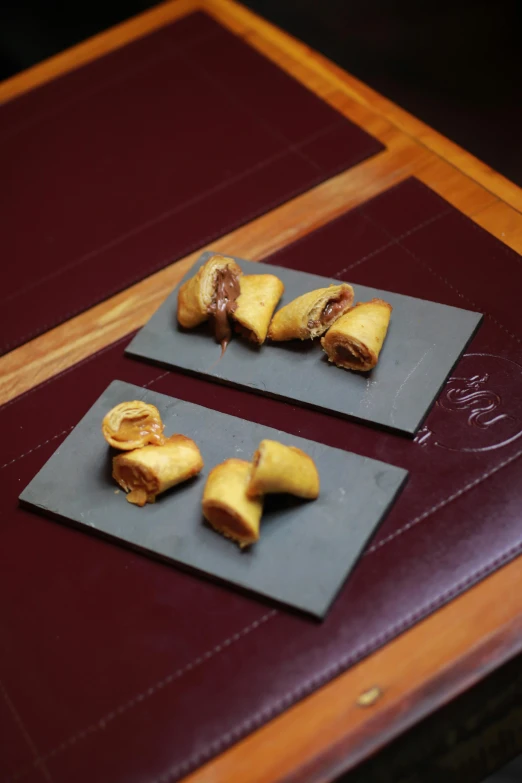 two plates with food are sitting on a table