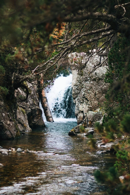 a small waterfall is shown from below