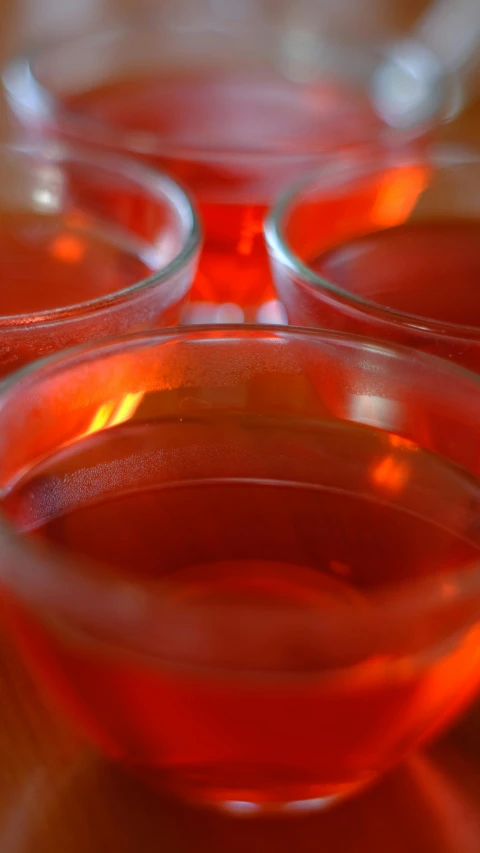 a table with glasses filled with liquid on it