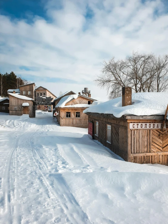 a cabin that is covered in snow