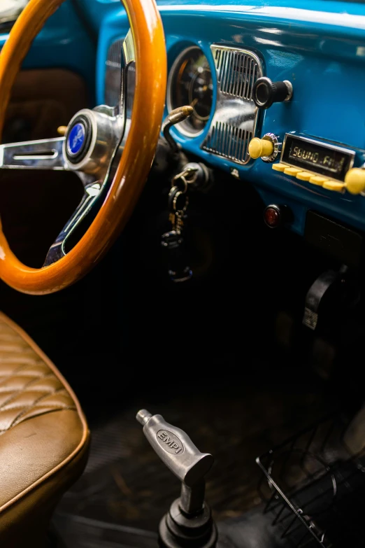 a steering wheel and dashboard in a vintage automobile