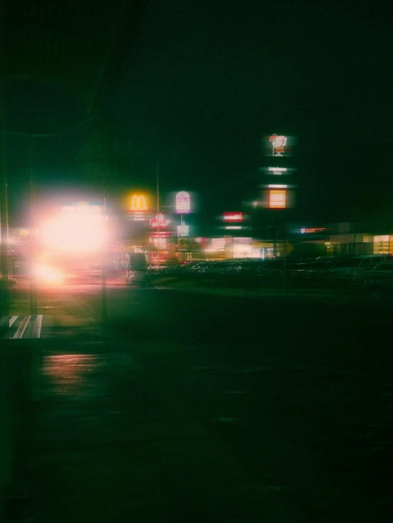 a blurry view of some cars at night