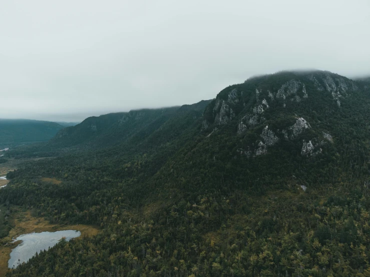 a mountain with trees in front of it