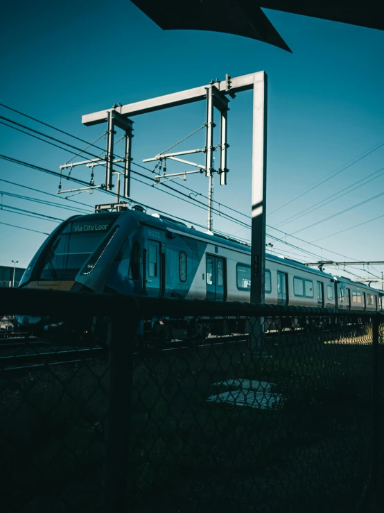 a train traveling down train tracks in a rural area