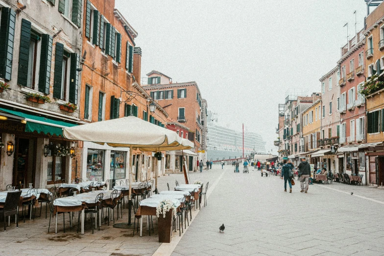 people on bikes are walking around a town