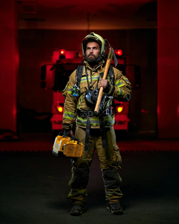 a firefighter posing with a large axe