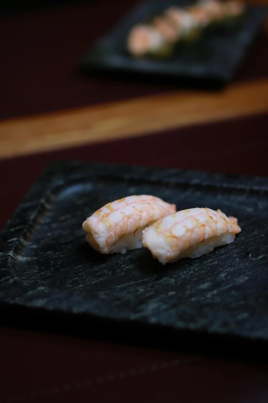 pieces of sushi are placed on a plate