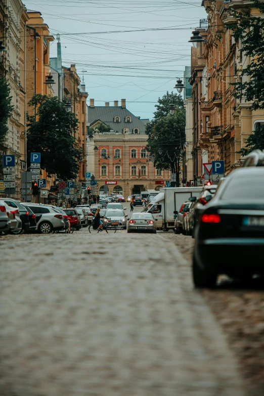 there is a very long city street in the middle of the day