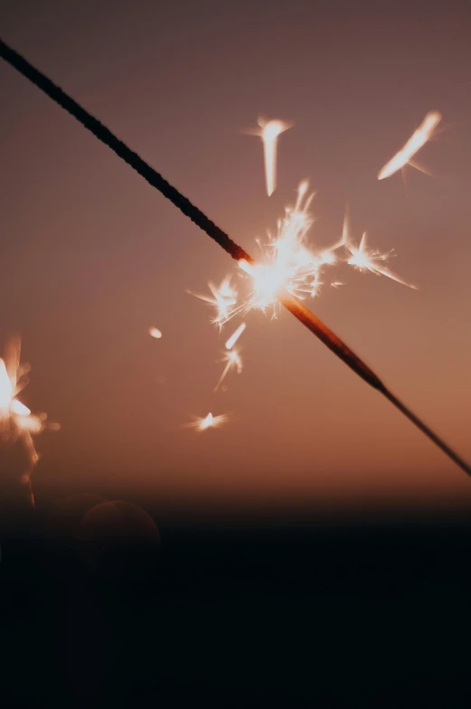 a picture of the sun in the sky with a sparkler coming out