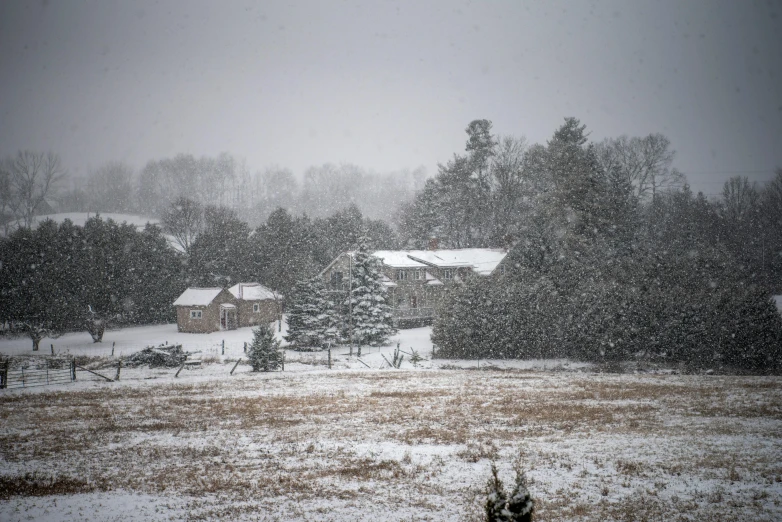 an image of a snowy village on a farm