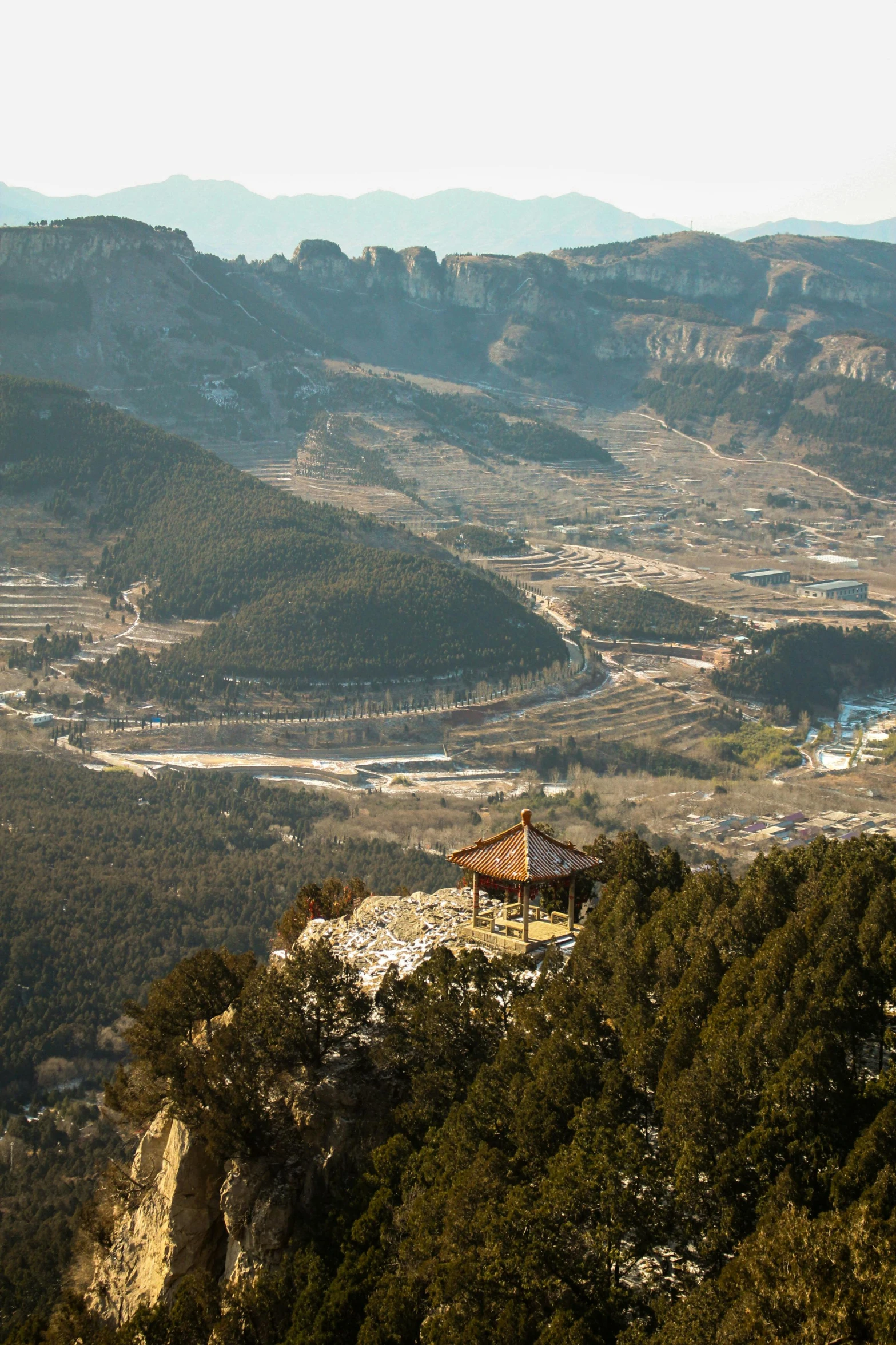 the view of some mountains, from a high point