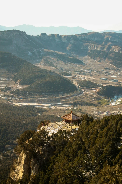 the view of some mountains, from a high point