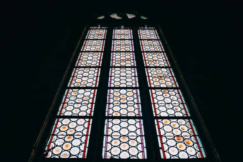 an image of stained glass windows with dark background