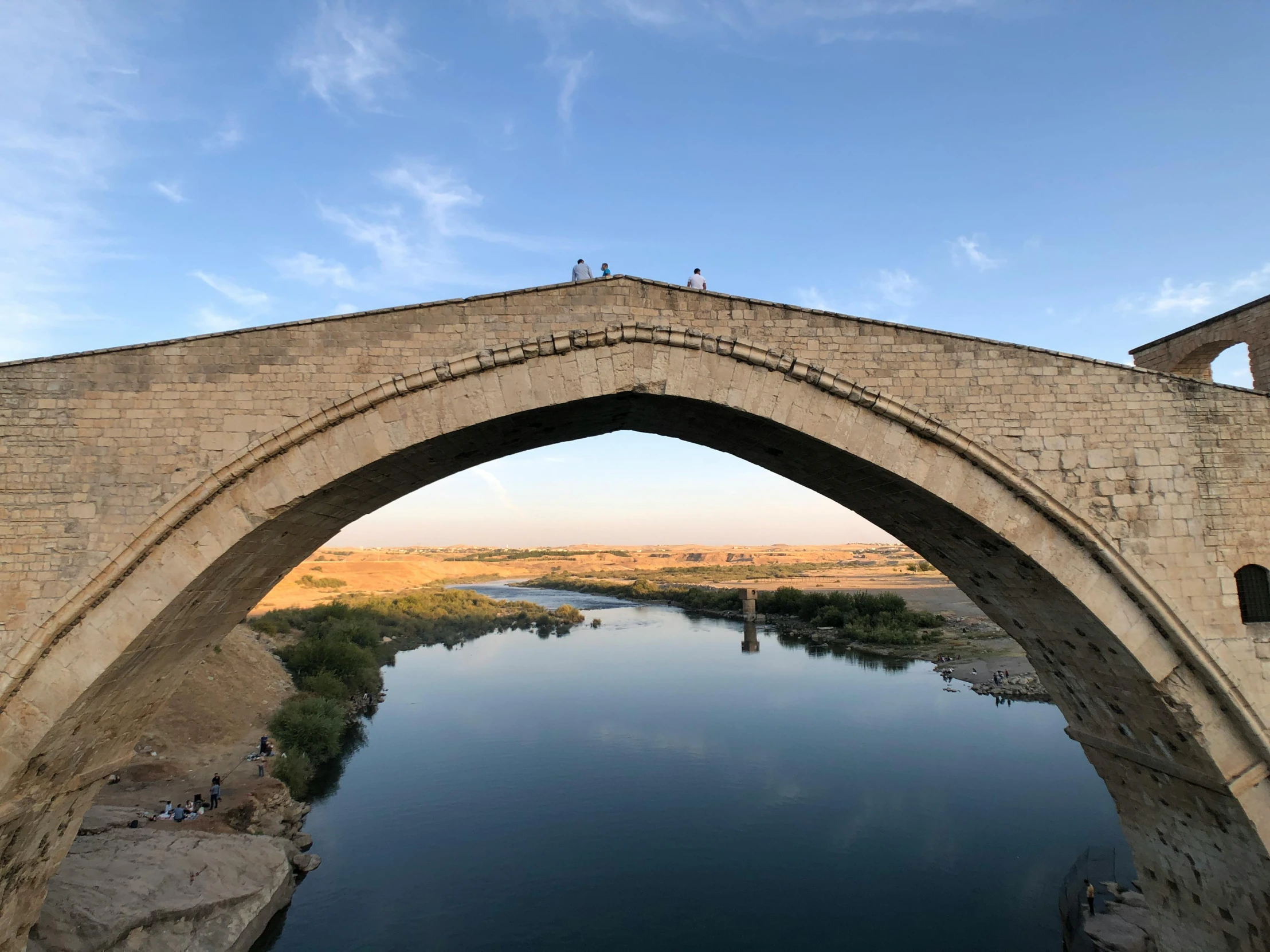 a bridge with a river on it as seen from underneath