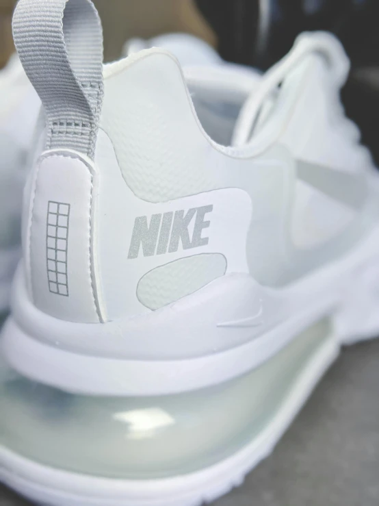 a close up view of the nike sneaker with white upper part