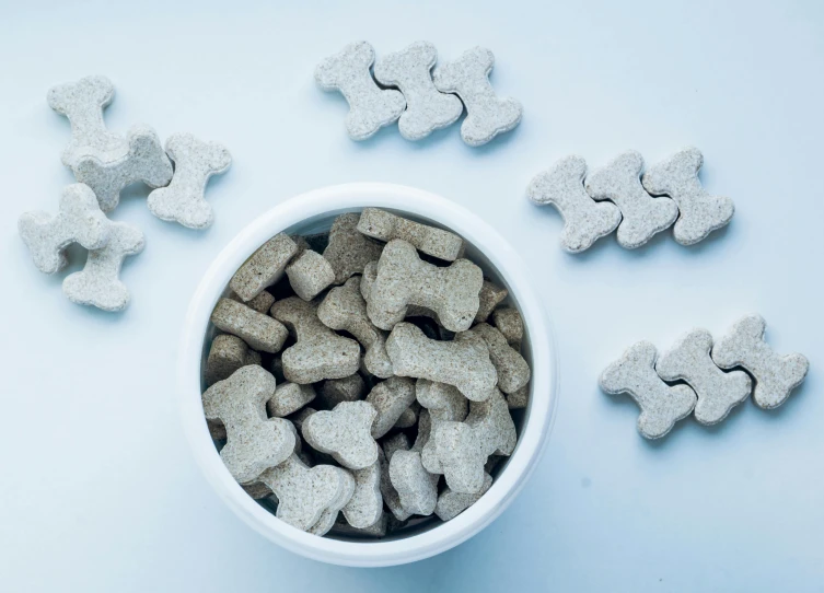 small bowl of heart shaped dog treat treats