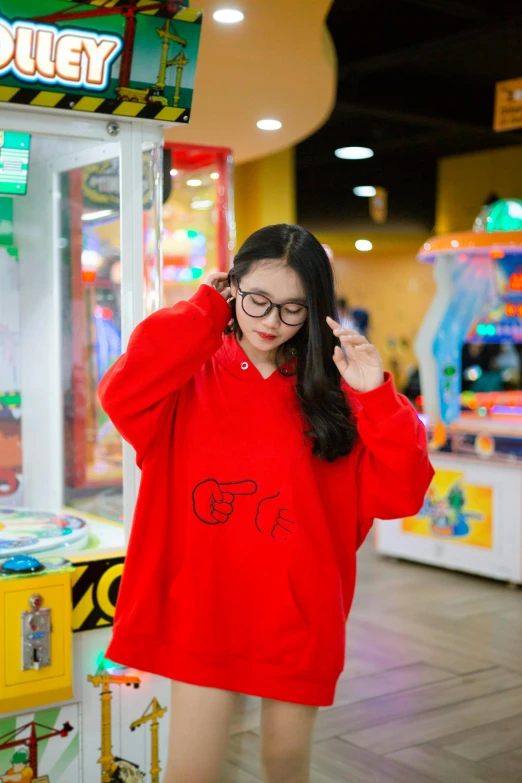 the woman is wearing glasses and has a red sweater