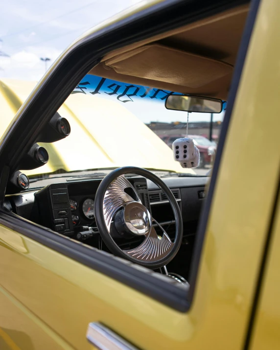 a car with its drivers side mirror sitting in the passenger seat