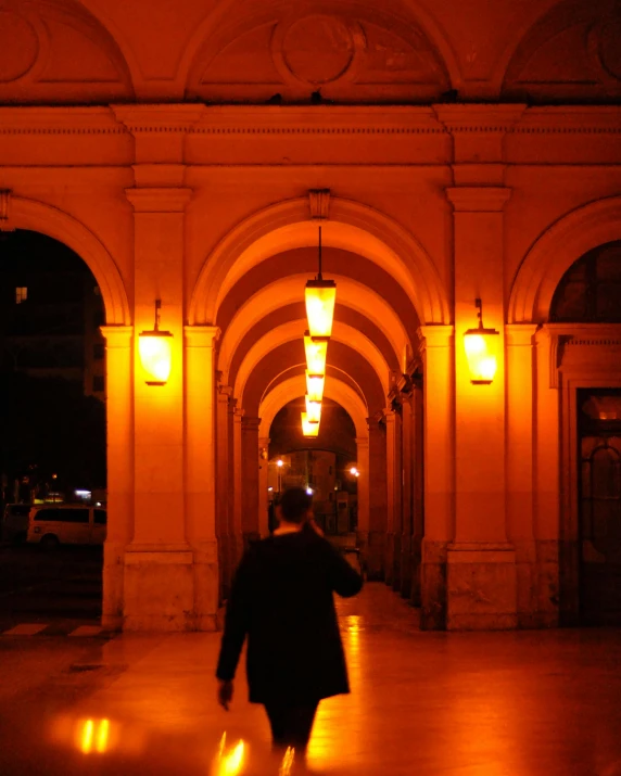 a person with a bag walking through a building