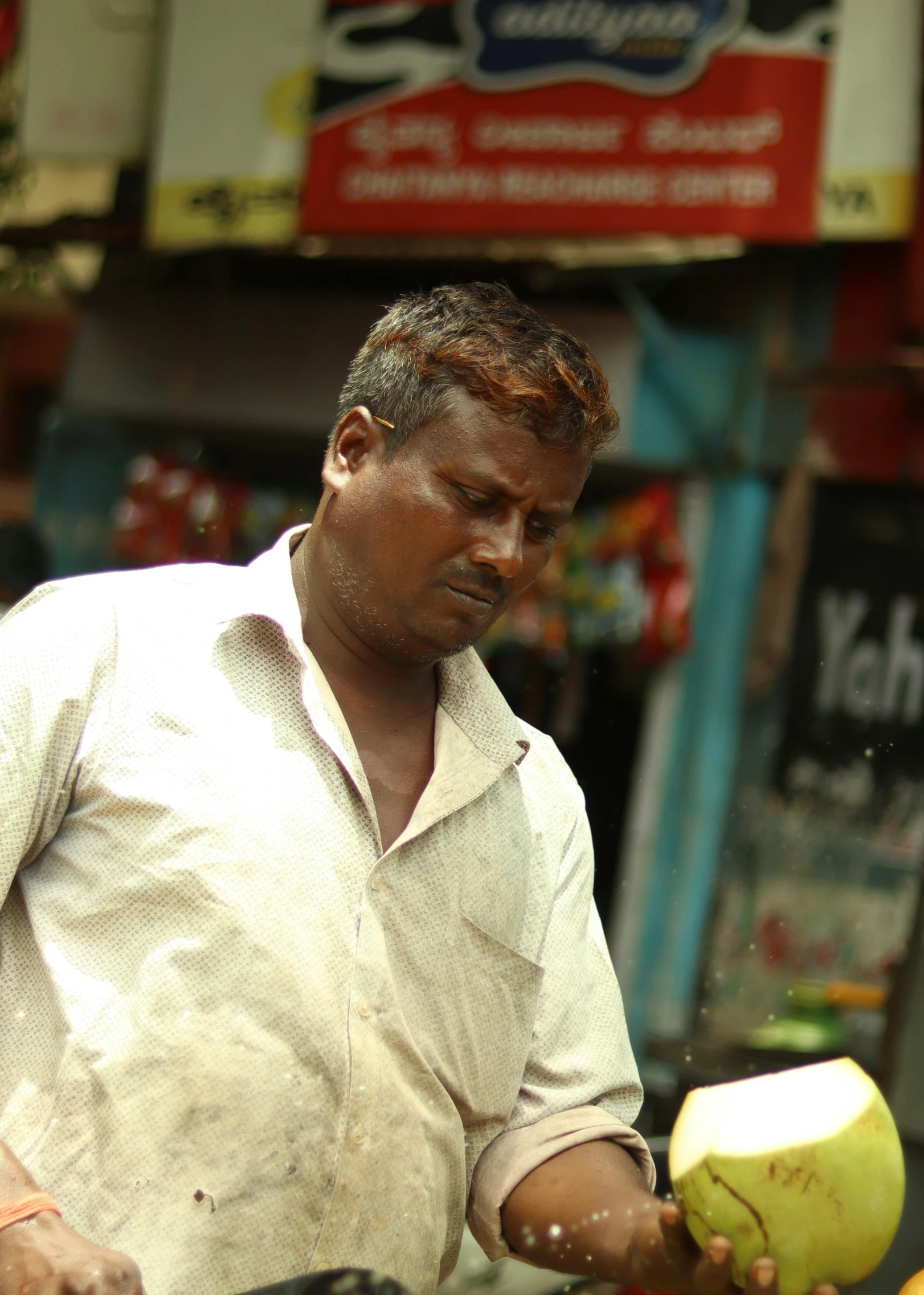 a man holds an apple in his hand