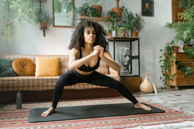 a woman doing yoga in her home living room